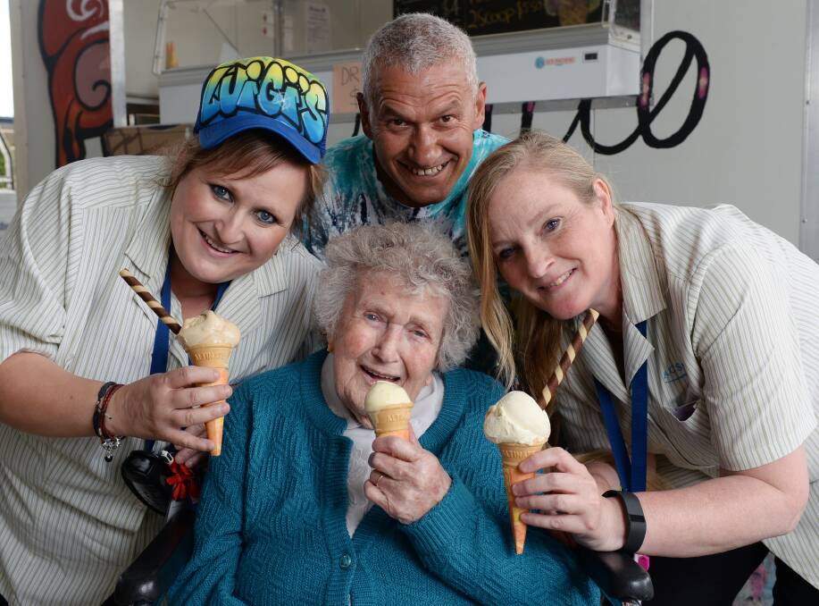 YUM: Kelaston's Kim Jeffrey, Tess Forbes and Devina Lopes enjoy the delicious ice cream served by Luigi Cudia. Picture: Kate Healy    