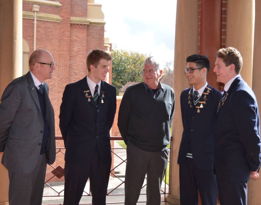CONNECT: Philip Nagle, centre, meets with headmaster John Crowley and student leaders Kelsey Gannon, James McKinnon and Jacob Hopper.