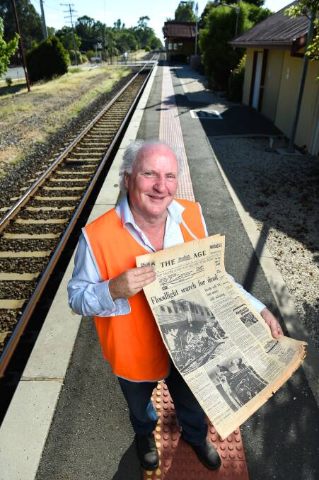 MEMORIES: Violet Town historian Bruce Cumming holds a copy of The Age published the day after the accident. Picture: Mark Jesser