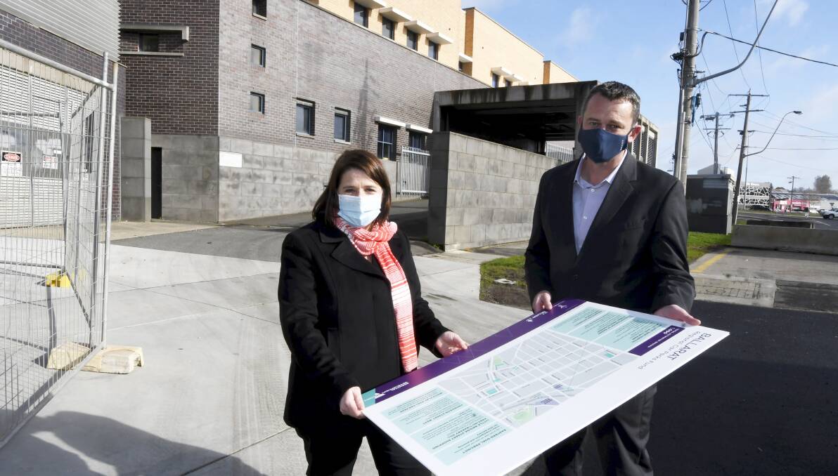 ANNOUNCEMENT: Juliana Addison and Ballarat mayor Daniel Moloney hold a map detailing the 1000 new free car park spaces planned for the city. Picture: Lachlan Bance
