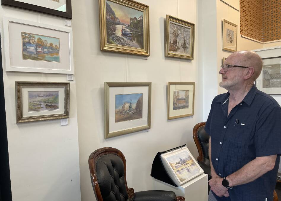 Ballarat artist Jon Crawley at his latest exhibition at Accent Framing and Fine Art in Sturt Street, Ballarat, which is open until the end of February. Picture by Erin Williams