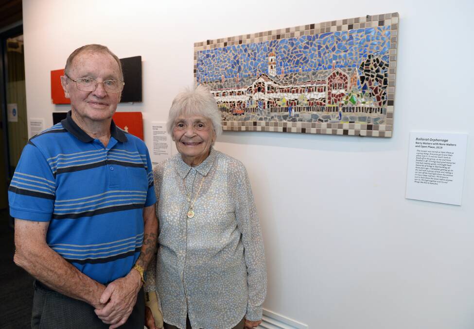 Ballarat Orphanage former residents Barry Walters and Nora Walters with a mosaic they finished together at Open Place in 2019. Completing the work brought back their memories of living in the orphanage. Picture by Kate Healy
