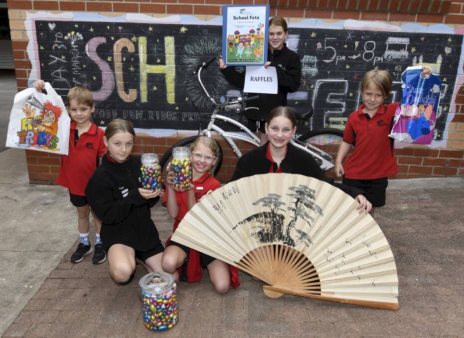 Buninyong Primary School pupils Flynn, Claire, Eve, Ei, Chloe and Finn have been busy preparing for the school's first fete since 2019. Picture by Lachlan Bence