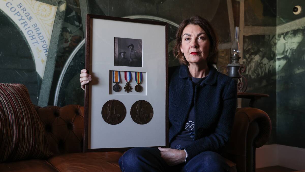 REFLECTION: Rose Hudson holds a photo and medals of her great-uncles, Farnel and James Mardling who were killed in action 105 years ago. Picture: Luke Hemer