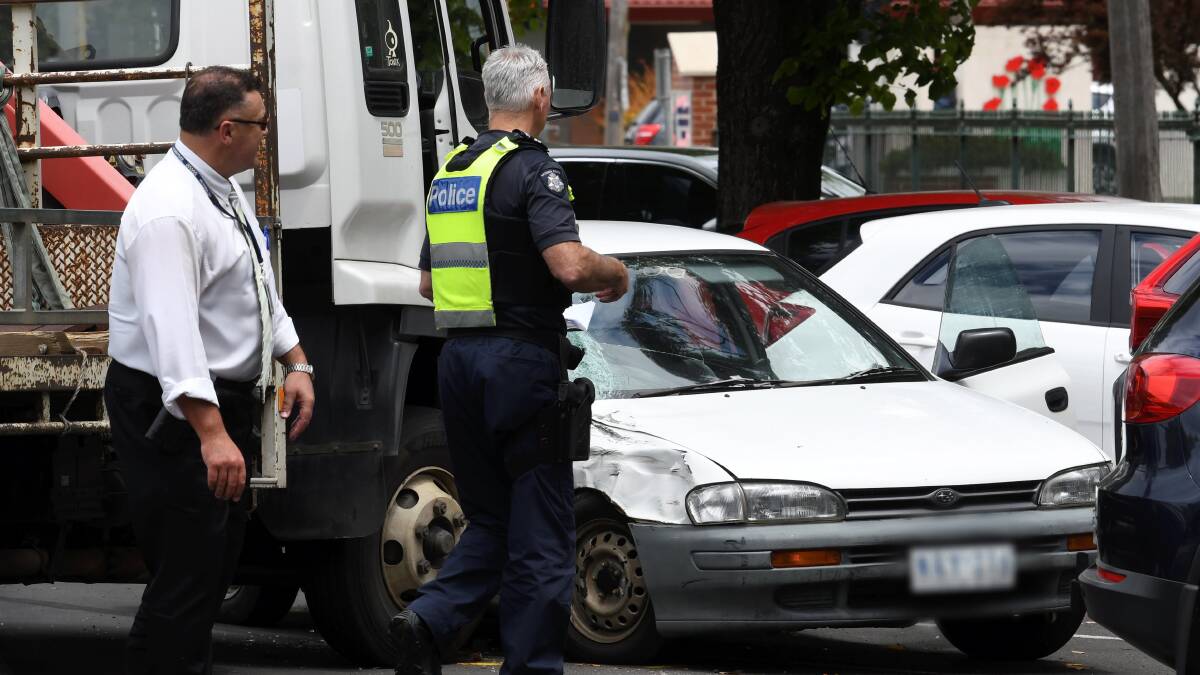 CRASH: Police assess the scene of a crash on Forest Street in Wendouree. Picture: Lachlan Bence.