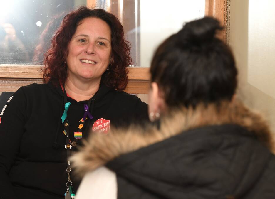 The Salvation Army youth case manager Susanne Barnet speaks with a client who unexpectedly became homeless. Pictures by Lachlan Bence