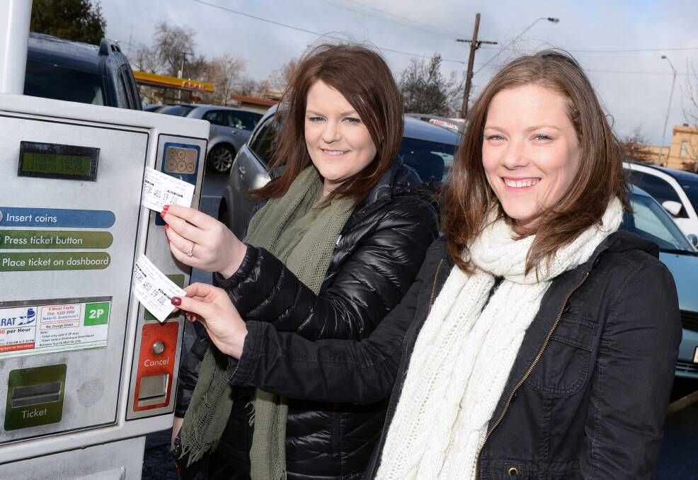THOUGHTFUL: Stephanie and Danielle Lee left their valid parking tickets on a machine outside Ballarat Health Services Base Hospital for other people to use. Picture: Kate Healy