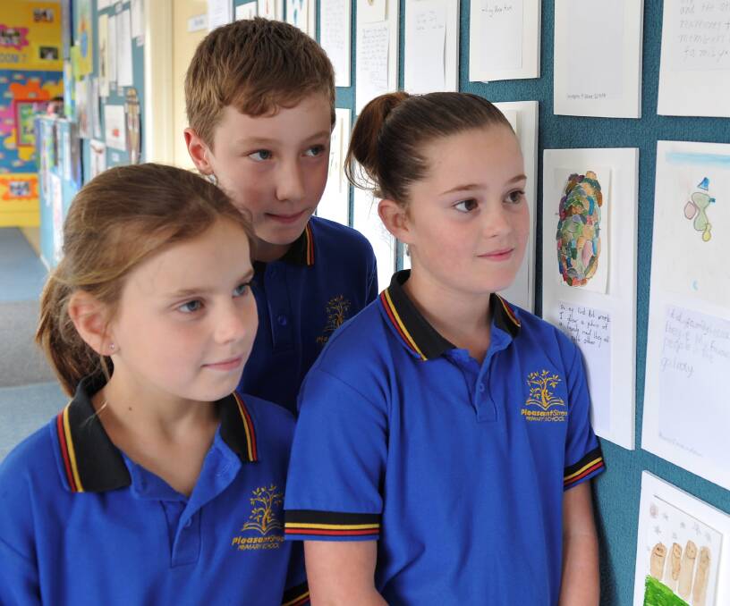 CREATIVE: Pleasant Street Primary School pupils Samantha, 9, Rhys, 9, and Riley, 10. Picture: Lachlan Bence