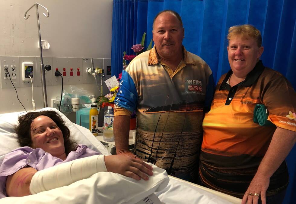 FROM HOSPITAL BED: Mr and Mrs Boswell travelled to Ms Tyler's side at Townsville Hospital to see how she was healing. Photo: Supplied.