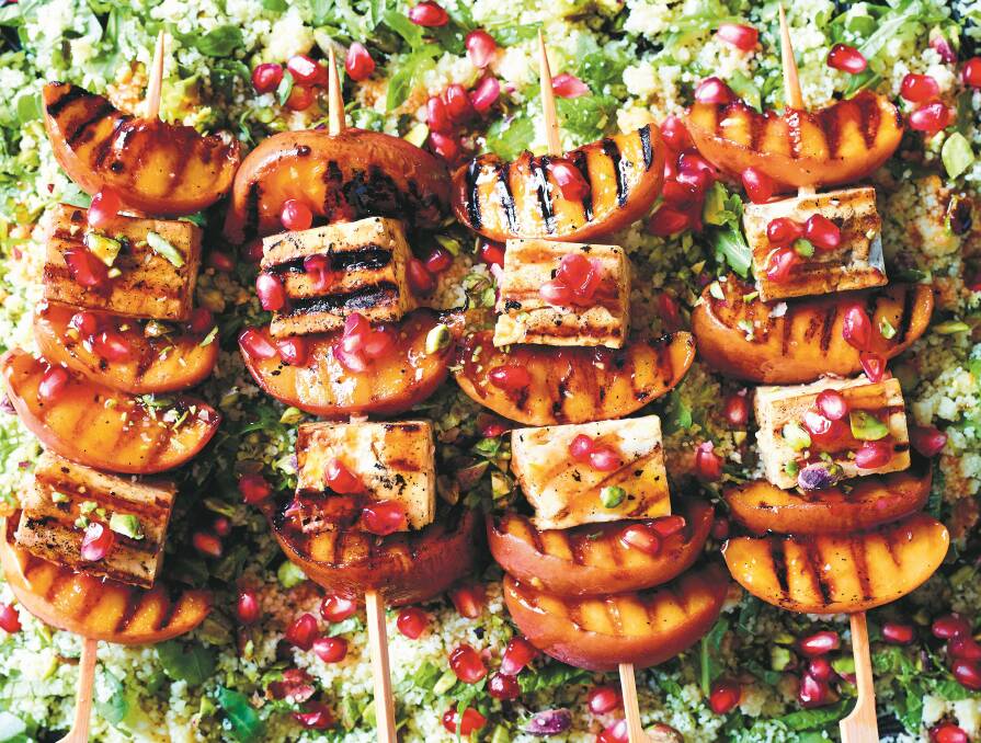 Barbecued haloumi with grilled peaches and green couscous. Picture: Mark Roper