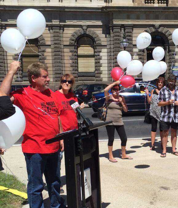 FLYING HIGH: Supporters of sexual abuse survivors fly balloons with ribbons tied to them outside the Town Hall. Picture: Ballarat City Council 