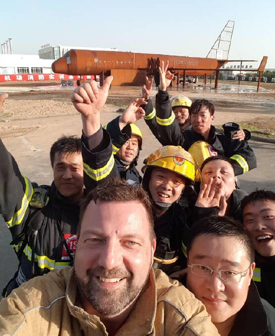 Ballarat's Peter McMahon with firefighters in the mega city of Wuhan in central China.