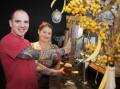 A first: Tim and Cass Smith pour a glass of Wattle It Be, which they brewed in The Pilot Room. Picture: BELINDA SOOLE