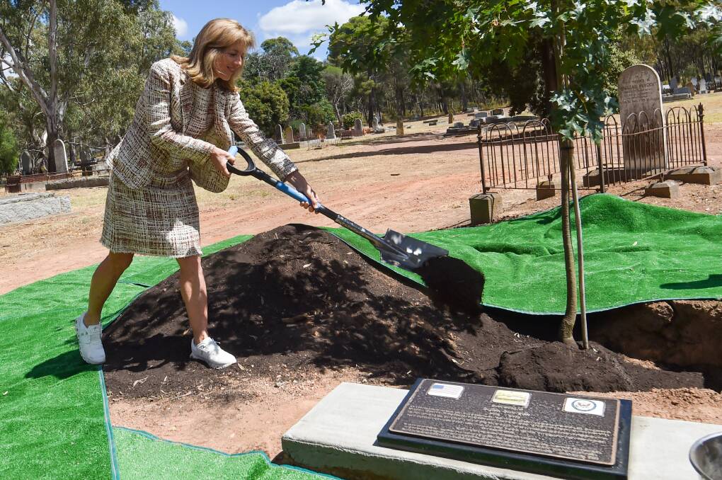 US ambassador Caroline Kennedy helps plant a tree at the new memorial to John Joseph. Picture by Darren Howe.