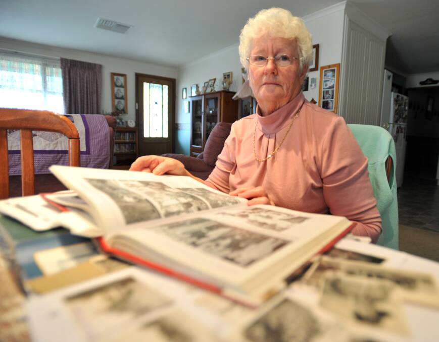 Lois Newman in 2009 with documents detailing the loss of the Montevideo Maru. Picture by Bill Conroy.