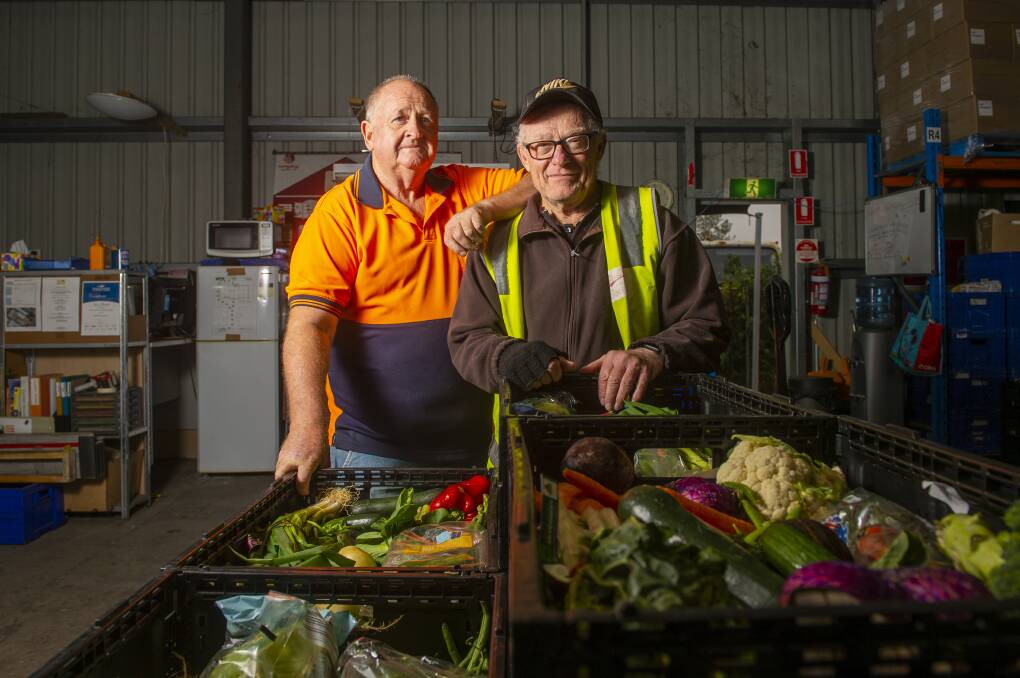 HELP US HELP THE NEEDY: John Walker and Graeme Dower after finishing their Monday morning run. Mr Walker says more volunteers would be welcome. Bendigo Foodshare increased its collections last year. Picture: DARREN HOWE