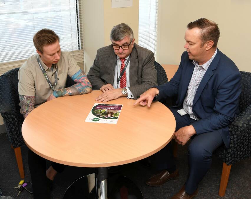 POSSIBILITY: headspace Ballarat's Andy Penny tables potential opportunities for job-seekers with Centacare chief Tony Fitzgerald and employment consultant Travis Preston. Picture: Lachlan Bence