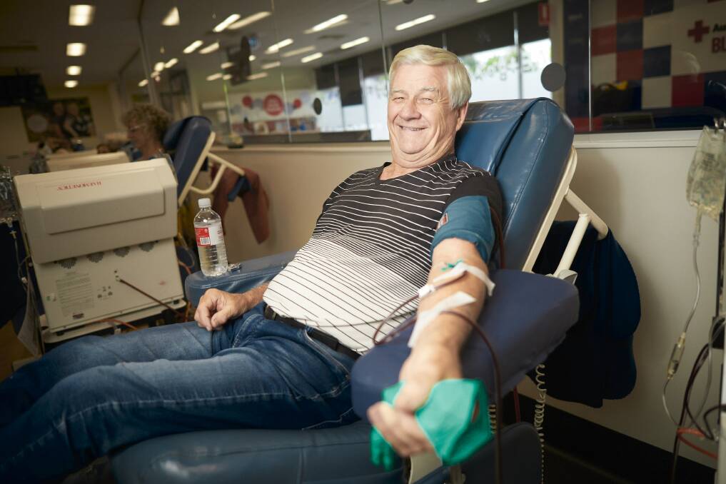 HERO: Anthony Foster rolls up his sleeves to make his 375th donation in the time when the blood bank needs it most. Picture: Luka Kauzlaric