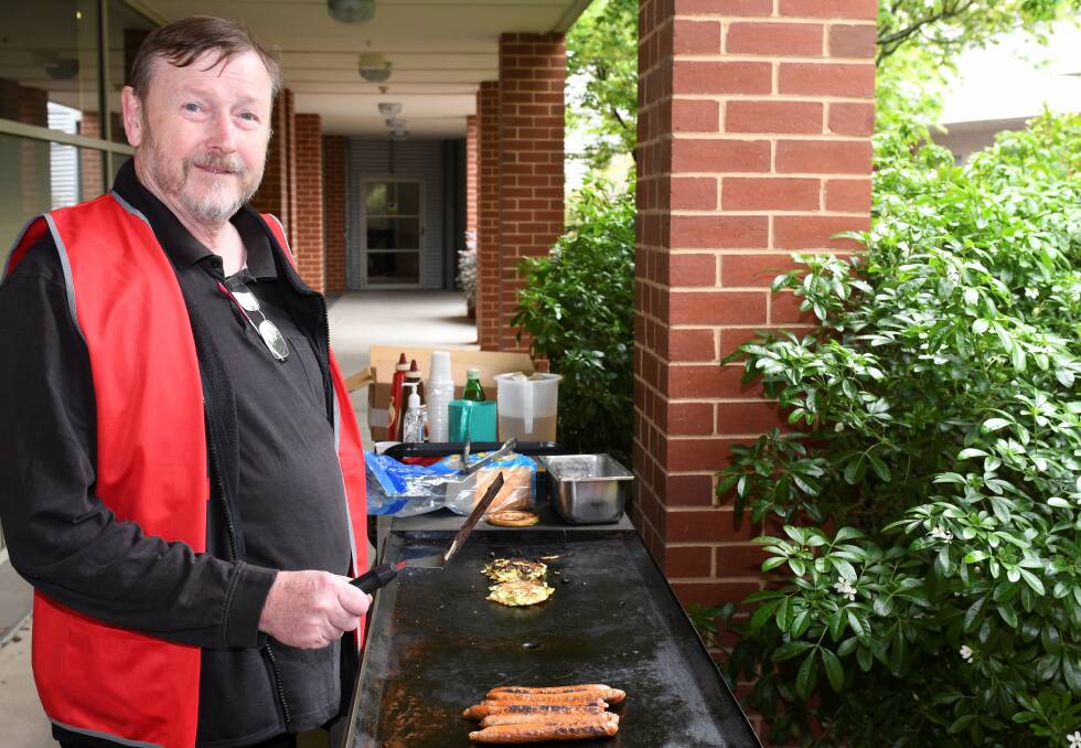 WELCOME: Ballarat Amputee Group president John McGregor fires up a barbecue to celebrate Amputee Awareness Week. Picture: Lachlan Bence