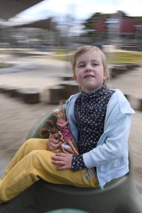 IN A SPIN: Sophie Luke, age five, gets dizzy. Picture: Lachlan Bence