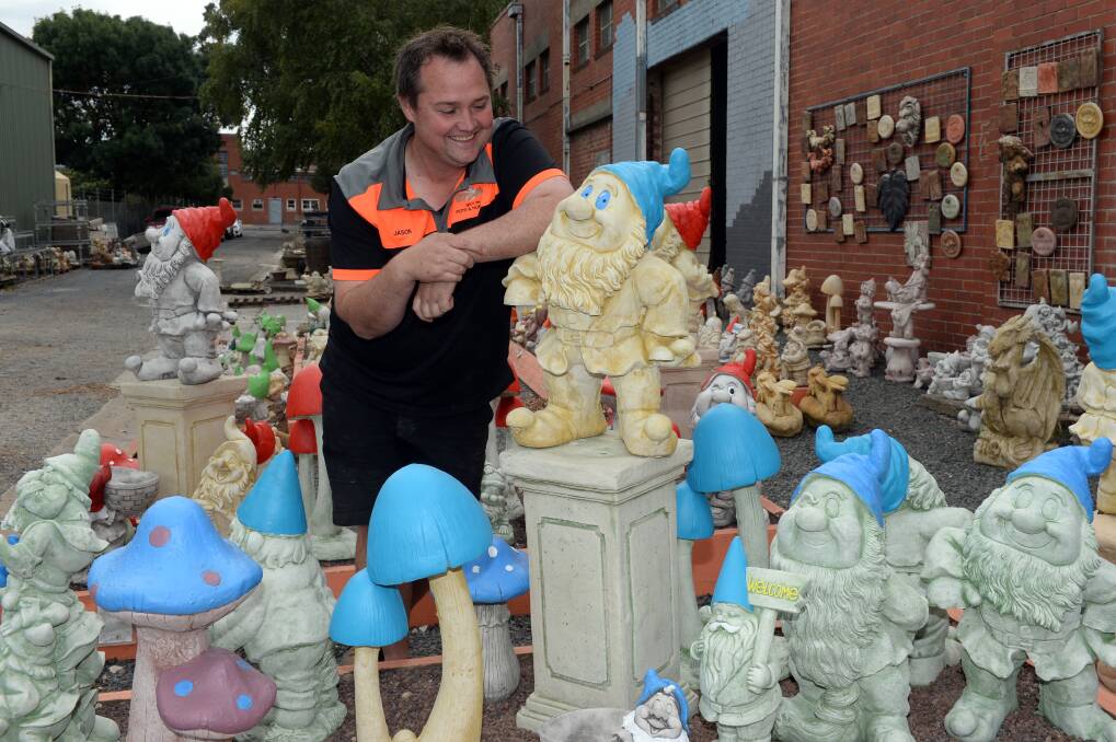 GNOME PLACE TO GO: Even the Montague (blue) and Capulet (red) gnome from movie Gnomeo and Juliet call a truce with Spot on Pots and Nursery's Jason Macdonald as they become stuck in the crisis. Picture: Kate Healy