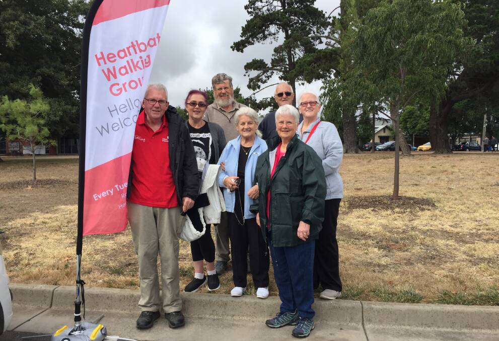 SHARING: Heartbeat Ballarat's walking group, with Barry Nixon and Julie Jules far left, sets out with new and varied faces each week to talk and walk the lake.