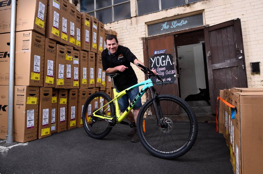 STOCKING UP: Cyclescape's Matt Britton pictured with a bike shipment to help keep up with demand still huge in people wanting to ride. Picture: Adam Trafford