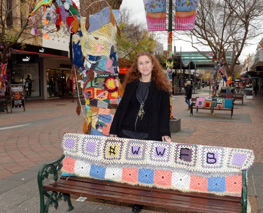 BOMB-SITE: Bridge Mall Business Association general manager Germaine Davey tours early displays for the yarn-bomb festival. Picture: Kate Healy