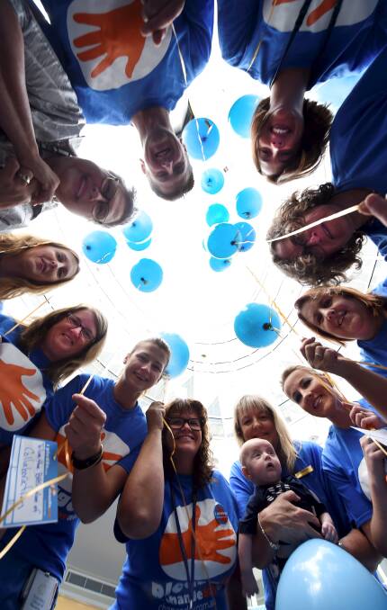 LAUNCH: Ballarat Health Services workers, in blue t-shirts, join Change Day Australia chief executive officer Mary Freer in pledging to make a difference. Picture: Lachlan Bence