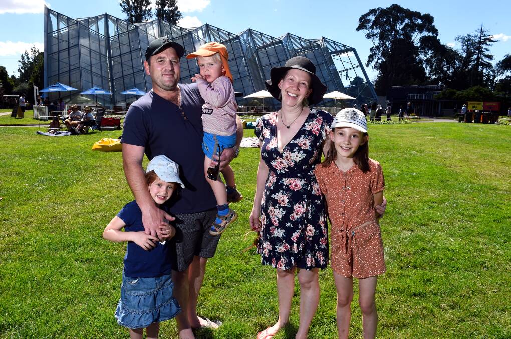 PICNIC TIME: Kavon Couwenberg and Imogen Nooney with Rose, Stanley and Grace for an afternoon on the lawns.