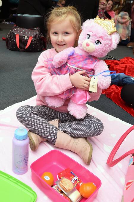 HUGS: Four-year-old Imogen and Rosy are ready to picnic with songs and story time at Ballarat Library on Wednesday morning. Picture: Kate Healy
