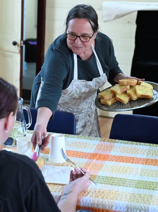 Jenni Sewell serves up garlic bread to go with lunch. Picture by Lachlan Bence