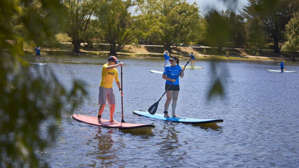 NEW WAVE: VicHealth's This Girl Can campaign has allowed Ballarat women to try new sports, like stand-up paddleboarding on Lake Wendouree. Picture: Luka Kauzlaric