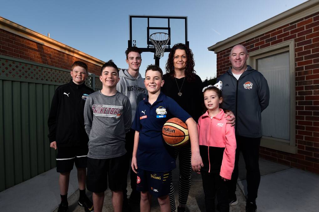 HOOP FIND: Big basketball family Hunter, Isaac, Fletcher, Archer, Mandy, Poppy and Lincoln Martin have gone old-school with driveway scrimmage sessions in lockdown. Picture: Adam Trafford