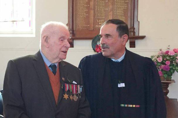 LEGACY: Ambulance field corporal George Prolongeau with Baptist minister Keith Lanyon, an Air Force chaplain at an Anzac Day service two years ago.