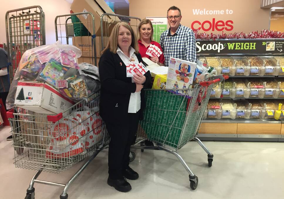 GIFT: Coles Wendouree's Sharon Germon, Sebastopol's Michelle Ladiges and 3BA's John Fitzgibbon show, as the jingle, good things are happening at Coles this Christmas.