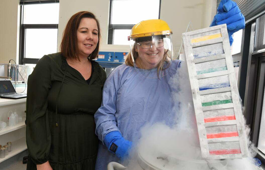 RESULTS: Fiona Elsey scientist Sharon Olsen shows donor Kathryn Kosloff a look at the institute's valuable tissue bank in the Ballarat laboratory. Kathryn was planning to donate a small part of herself to research. Picture: Lachlan Bence