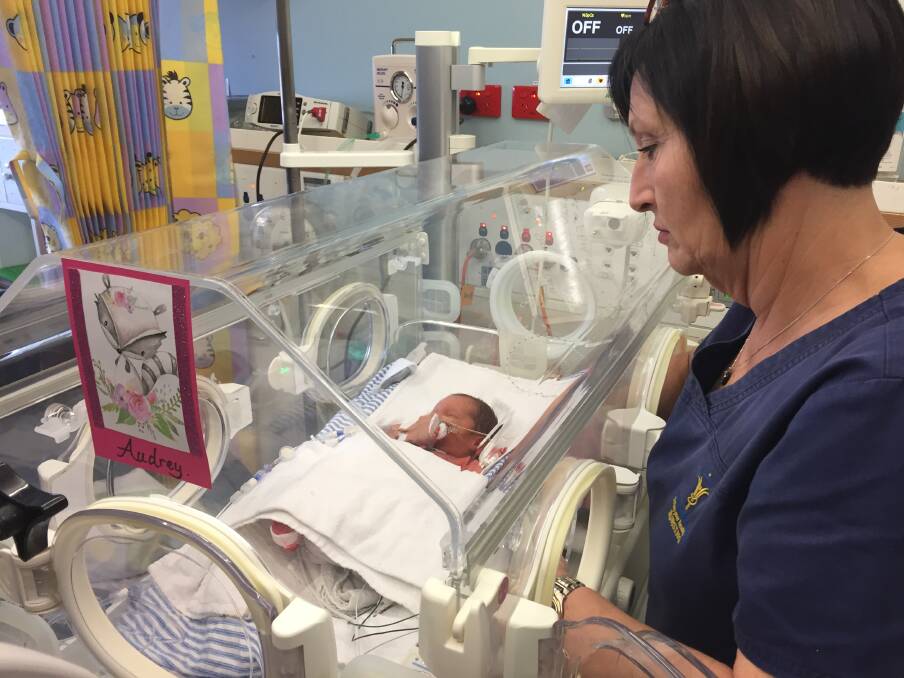 CLOSE WATCH: Ballarat nurse Liz Burtenshaw checks in on three-day-old Audrey in the Base Hospital's special care nursery on Tuesday morning. 