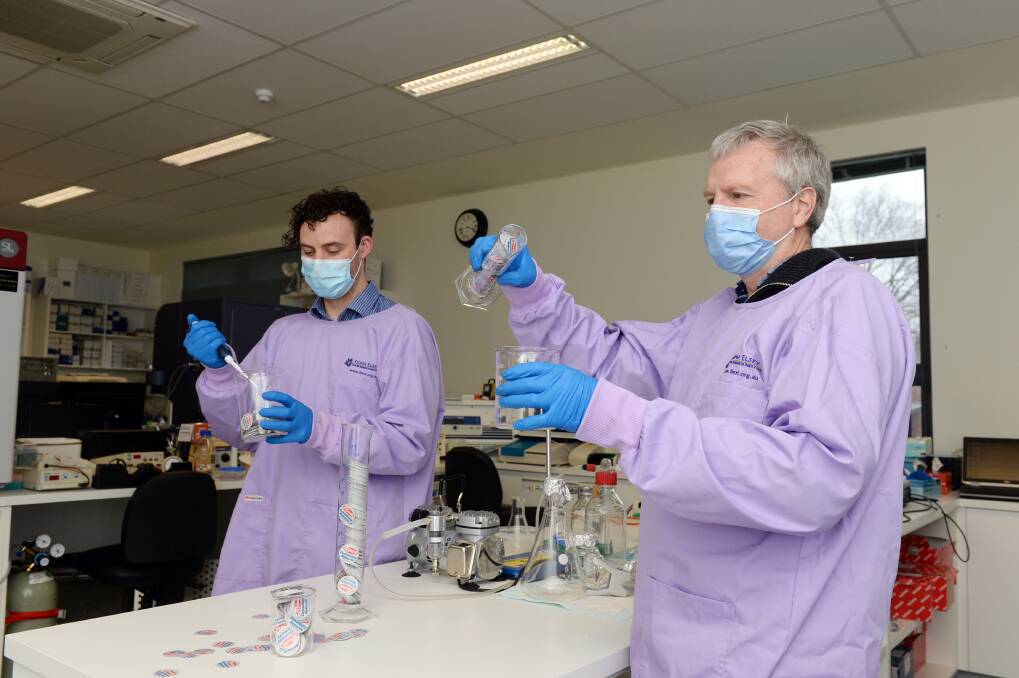 TO THE TEST: Fiona Elsey Cancer Research Institute's laboratory technicians Tobias Meredith and Brendan Toohey get to work after a sizable community donation via Ryan's IGA stores. Picture: Kate Healy
