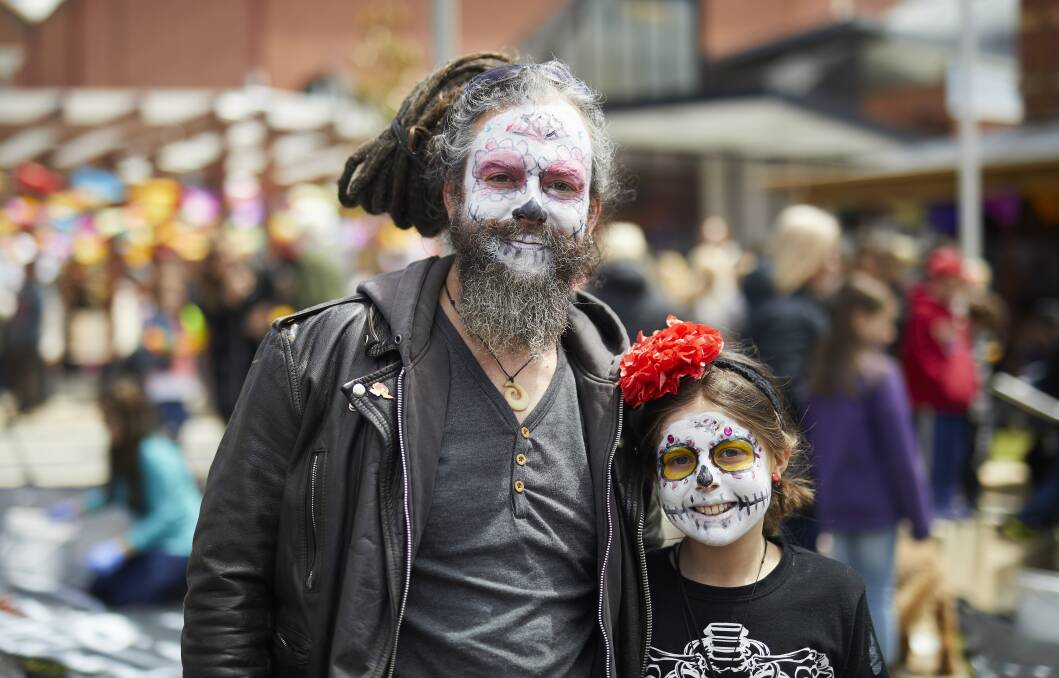 SMILES: Marcial Cano-Perez and Ruby Cano-Perez learn about Day of the Dead festivities in Alfred Deakin Place, Ballarat. Picture: Luka Kauzlaric