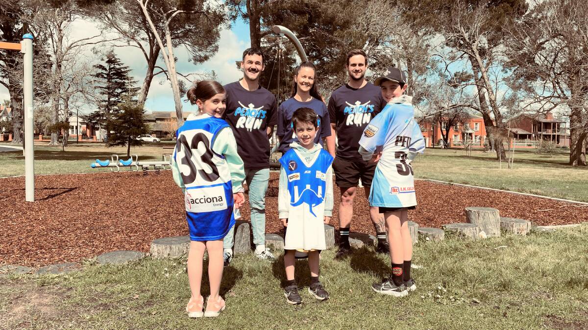 James Petrie's friends and family (back) Beau Adams, Emma Petrie, Nick Lawrance, (front) Millie, Cooper and Paddy, are proud to run in his honour for mental health awareness.