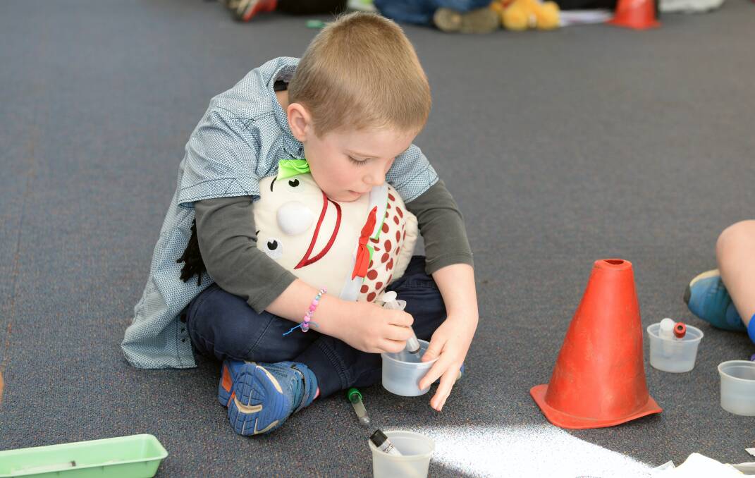 TEST: Kallen gives his friend Humpty Dumpty a blood test to show you can be brave with needles. Picture: Kate Healy