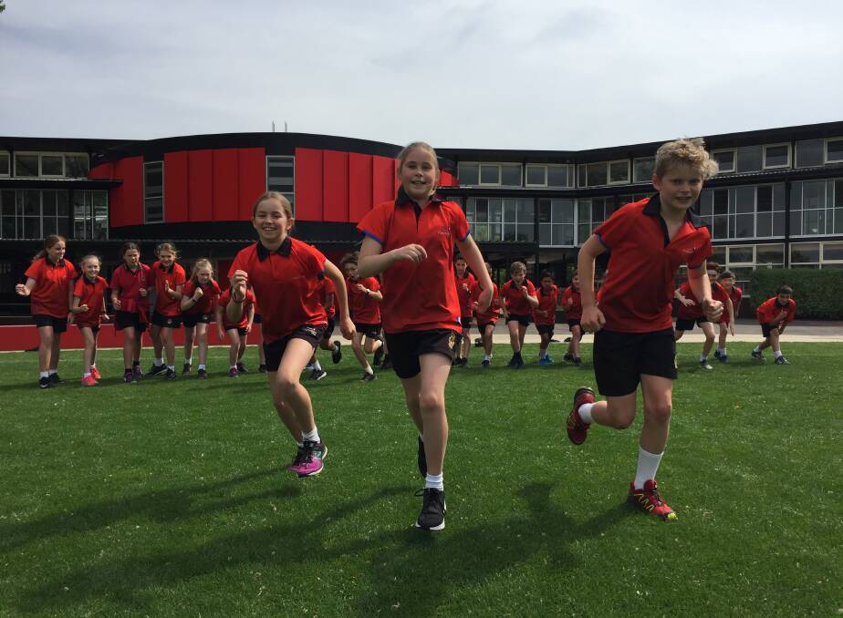 SET: Ballarat Clarendon College pupils Lucy, Alexandra and Alistair get in the fun running spirit on Friday.