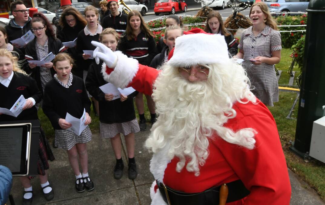EXPERT: Santa conducts Mount Clear College's choir. Picture: Lachlan Bence