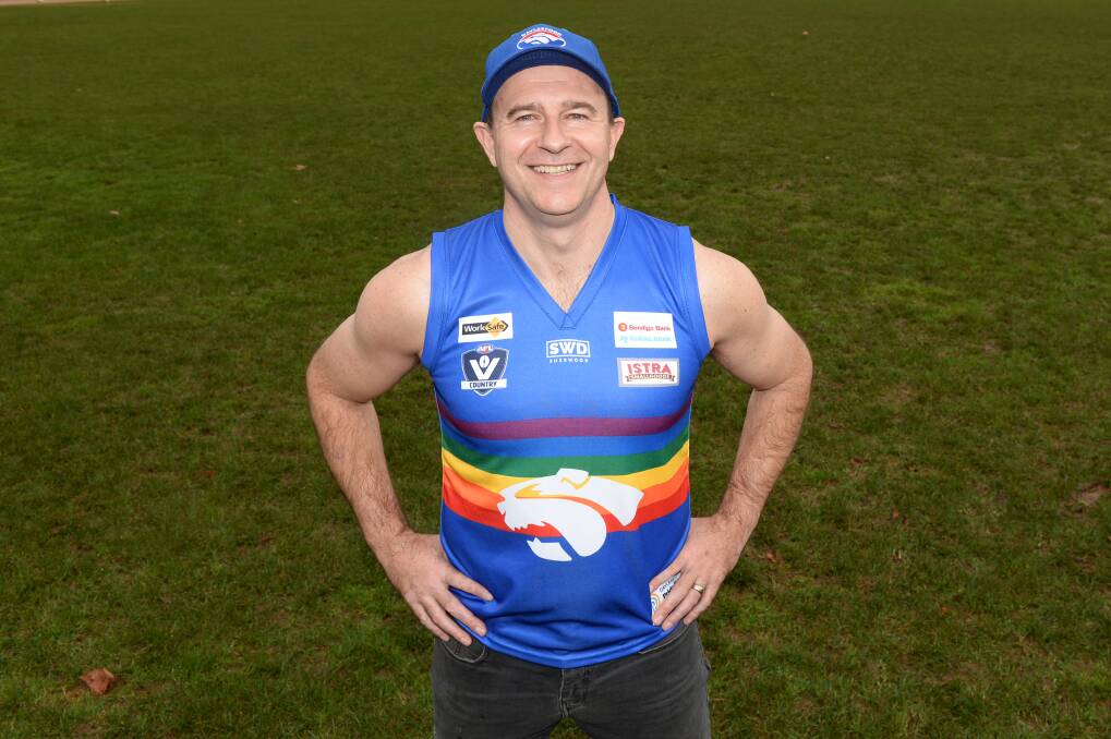 INCLUSIVE: Daylesford Football Netball Club president Carson White pulls on the Bulldogs' pride guernsey ahead of the pride cup with Newlyn in 2019. Picture: Kate Healy