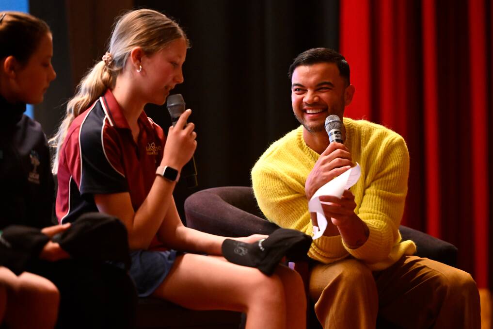 Delacombe primary pupil Ruby speaks on stage with Guy Sebastian at Regent Cinemas. Picture by Adam Trafford