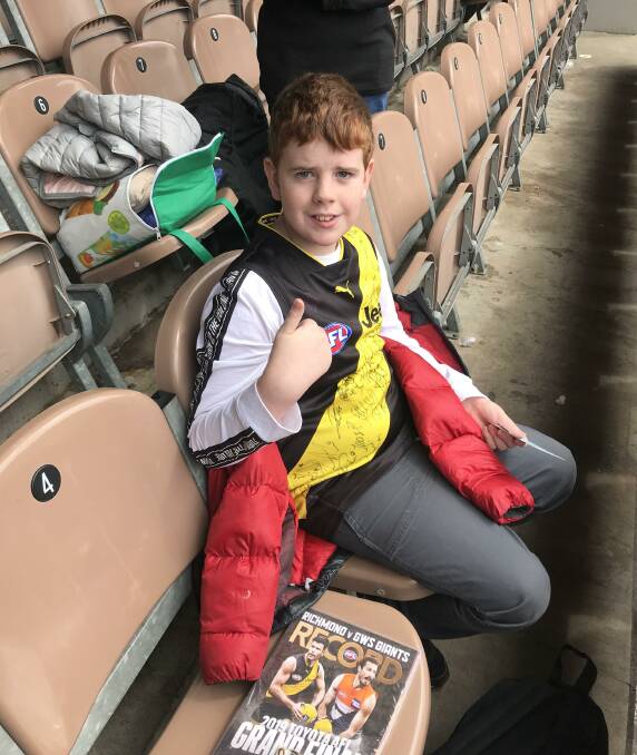 READY: Blake Dridan takes his seat at the MCG to watch his beloved Tigers face GWS Giants on AFL Grand Final day.