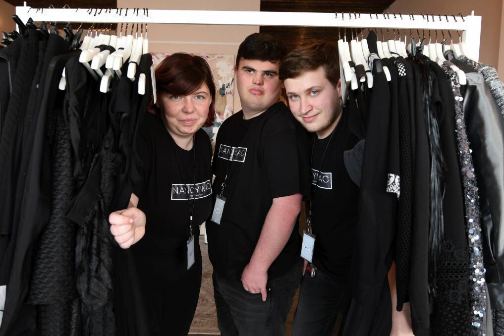 AT YOUR SERVICE: NancyMac boutique attendants Letitia Yates, Jesse Cullinan and Mason May-Farra get to work on opening day. Picture: Lachlan Bence