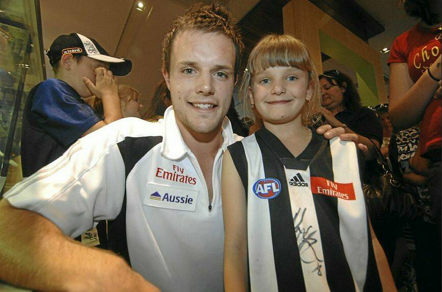 Then-Collingwood footballer Nathan Brown meets a young fan in a Ballarat function in 2009. Brown, a Ballarat Swans' junior export, went on to become a premiership player with the Magpies a year later. Picture Narelle White