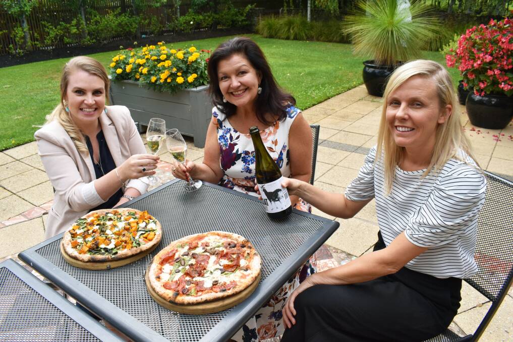 TASTING PLATE: Forge Pizzeria's Alex Kay and Kellie Pearce enjoy some pizza and wine with Ballarat mayor Samantha McIntosh (centre) ahead of the Begonia Festival.